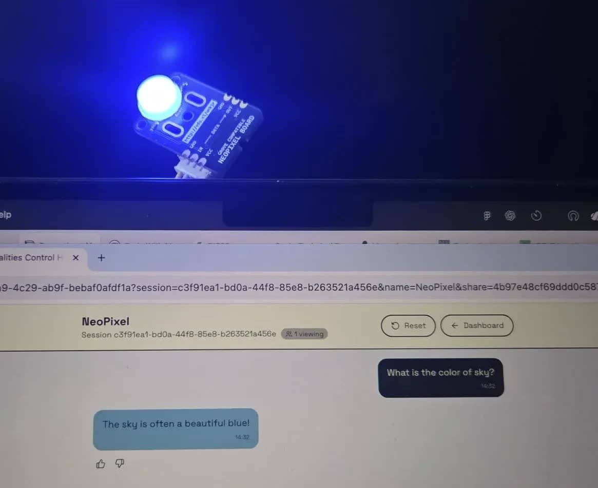 A NeoPixel LED glowing blue beside the Control Hub chat, where the answer to "What is the color of sky?" is "The sky is often a beautiful blue!"